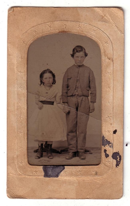 Tin type photo of young girl and boy from the 1860s